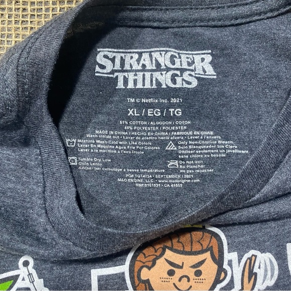 Stranger Things 20 Piece Bundle: Metal Tin, 14 Patches, Backpack, 5 T-shirts - Picture 6 of 16